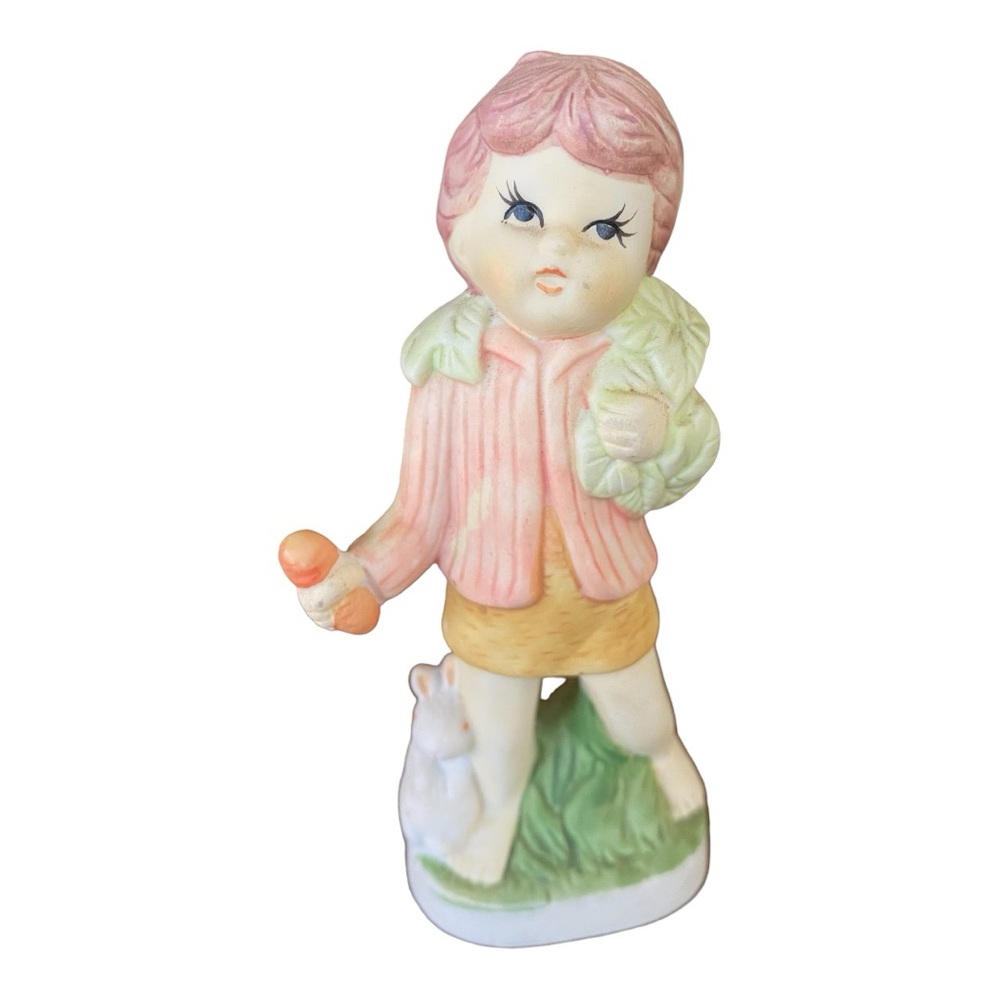 Vintage porcelain figurine child with bunnies